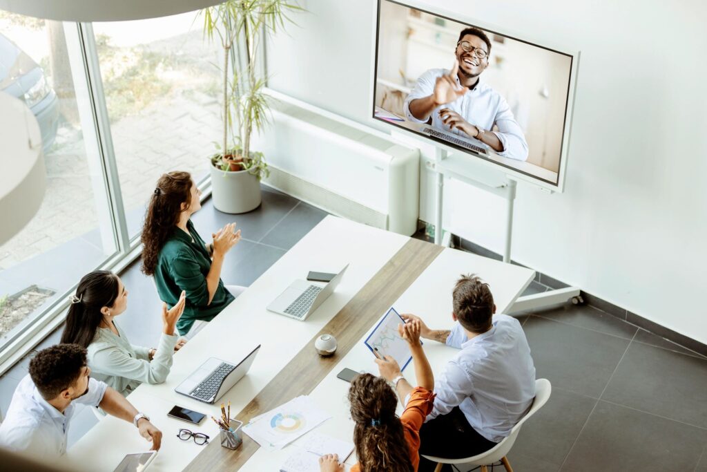 remote sales team meeting modern office